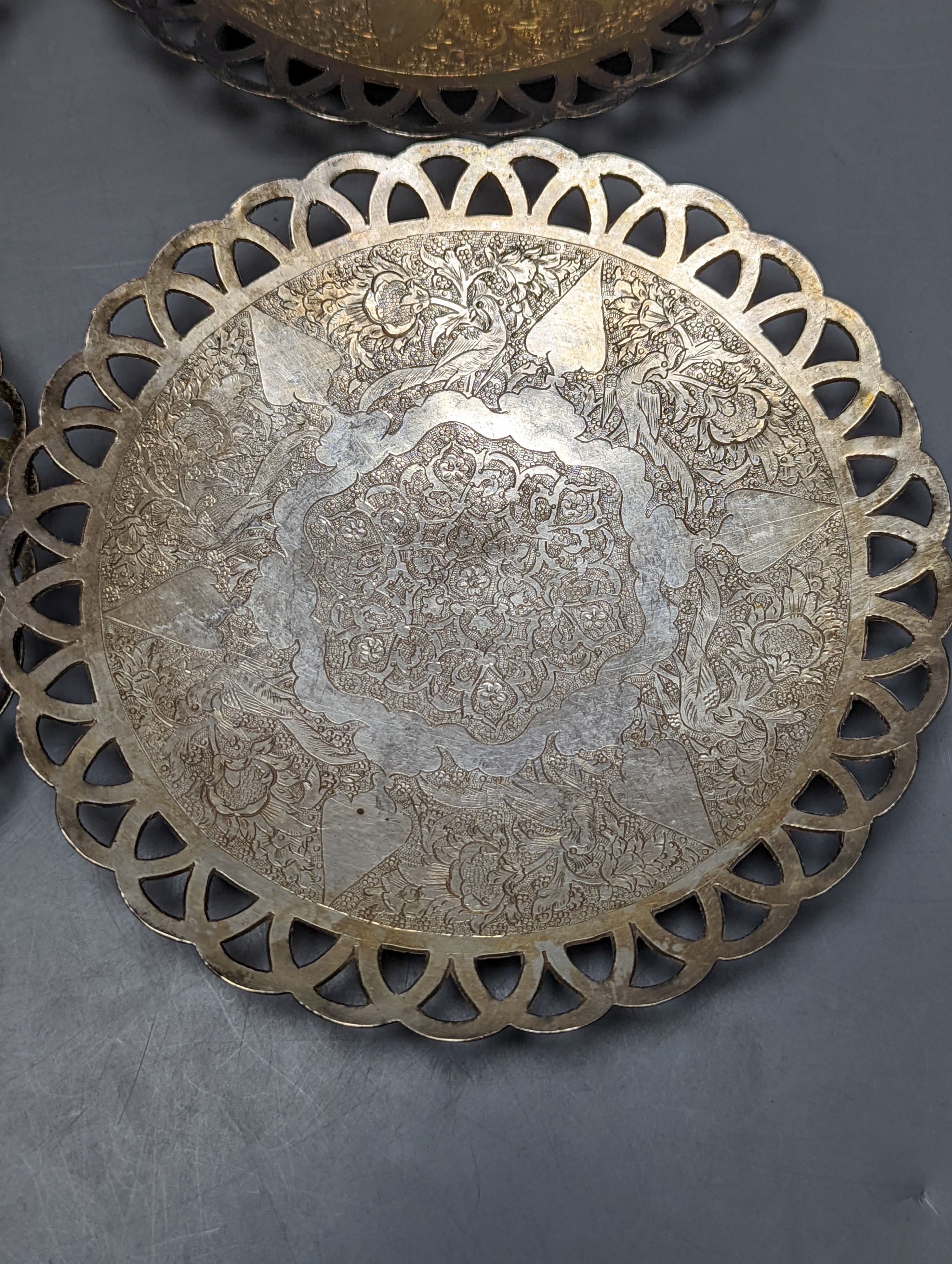 A set of six Persian white metal circular shallow dishes, with pierced borders, 16.3cm, 972 grams.